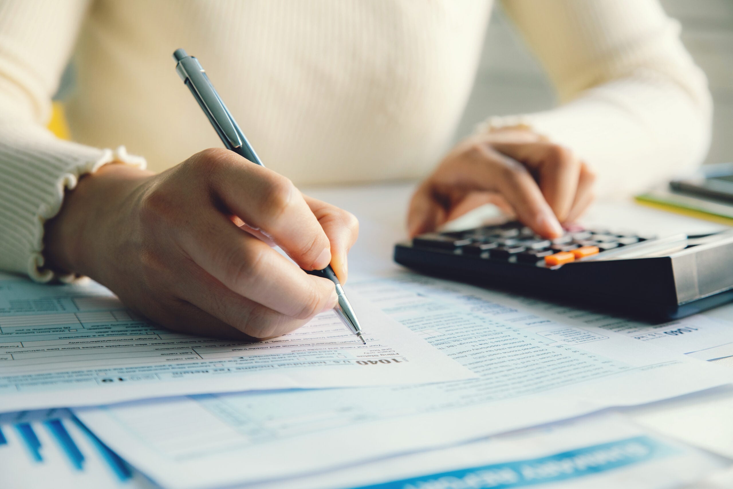 Closeup Woman Filing Tax Return,